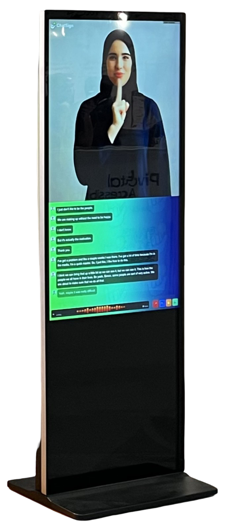 A tablet showing a sign language avatar on a desk in an office.